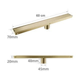 Caniveau de douche encastré or brossé