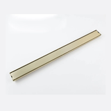 Caniveau de douche encastré or brossé