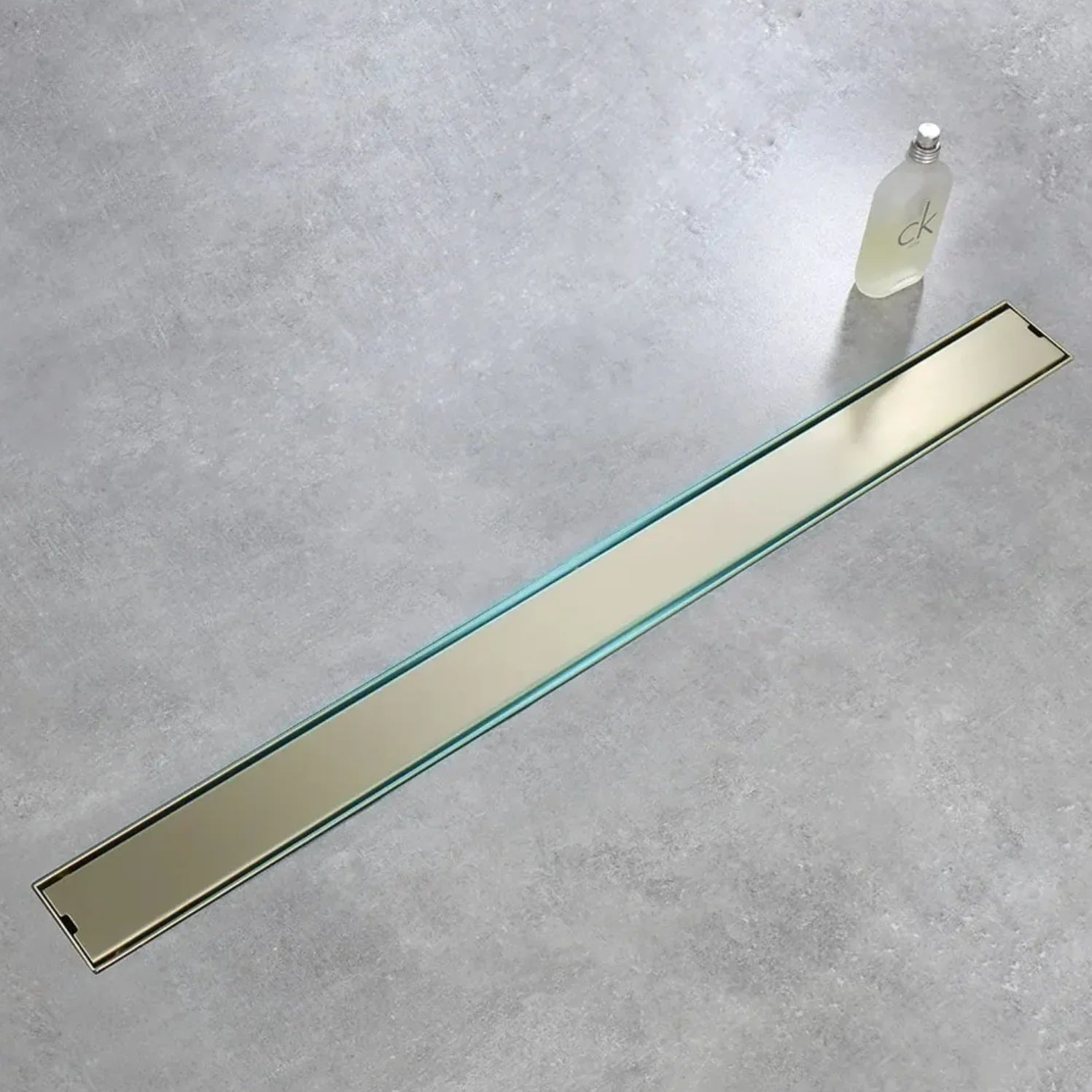 Caniveau de douche encastré or brossé