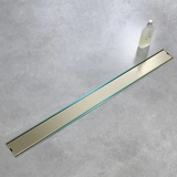 Caniveau de douche encastré or brossé