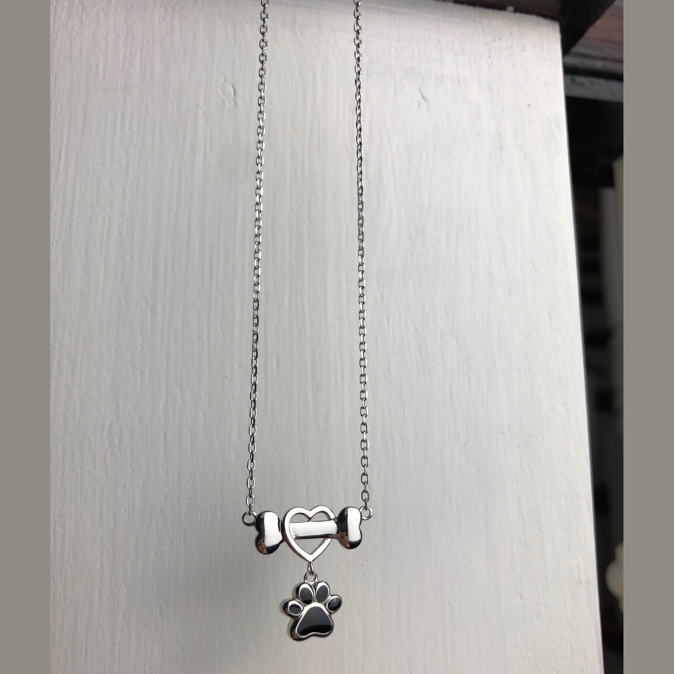 Zierliche Hundepfoten Halskette aus Edelstahl
