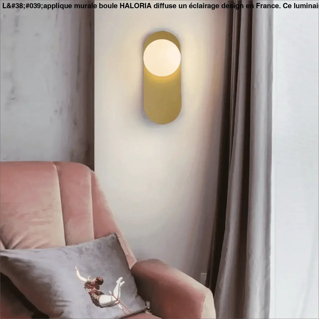 Applique mural boule moderne en forme cylindrique dorée avec lumière circulaire douce par haloria