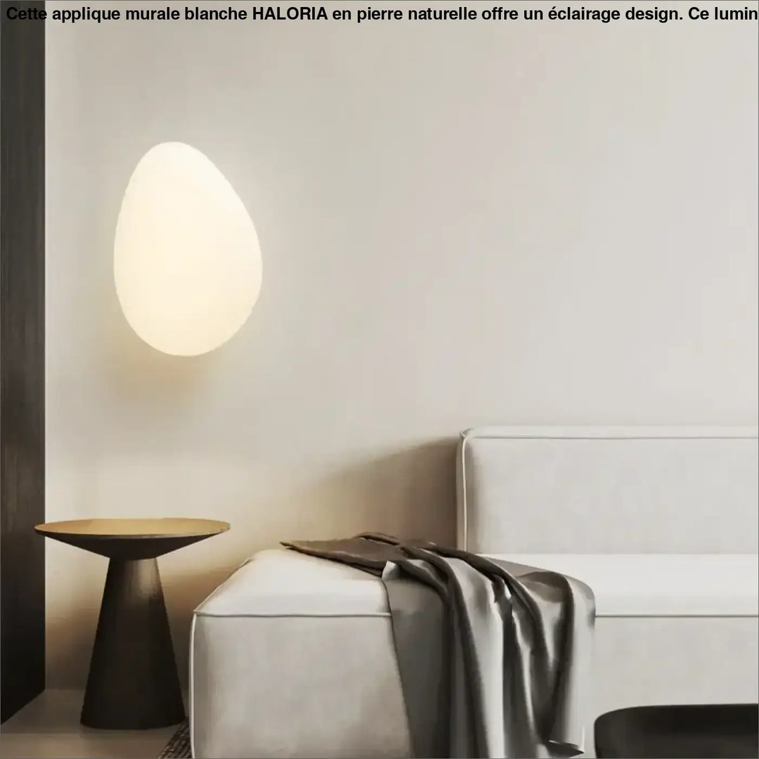 Applique murale blanche en forme de pierre naturelle avec finition mate et design ovale doux par HALORIA
