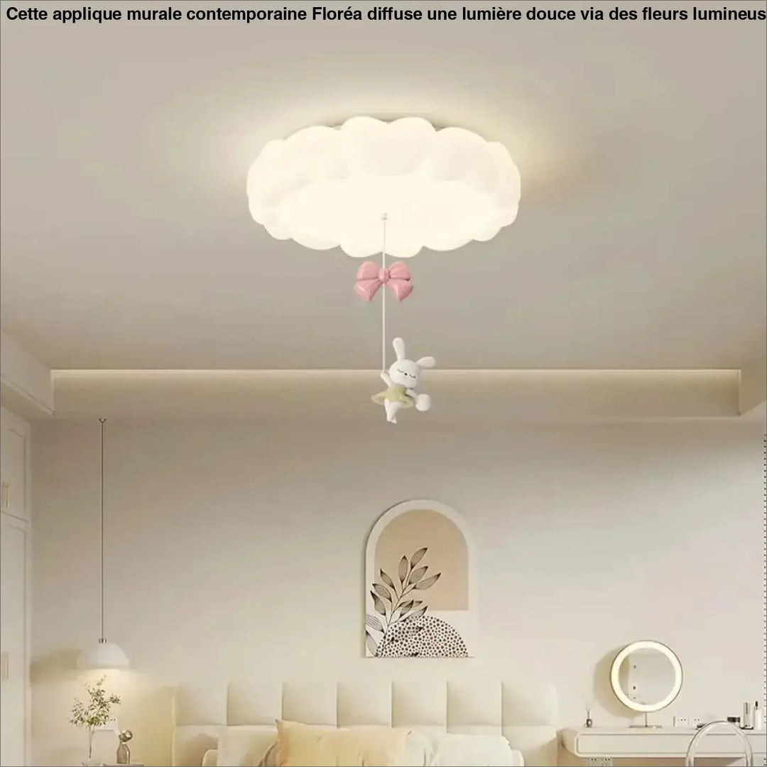 Luminaire plafonnier blanc en forme de nuage avec un noeud rose et une peluche lapin pour salle à manger
