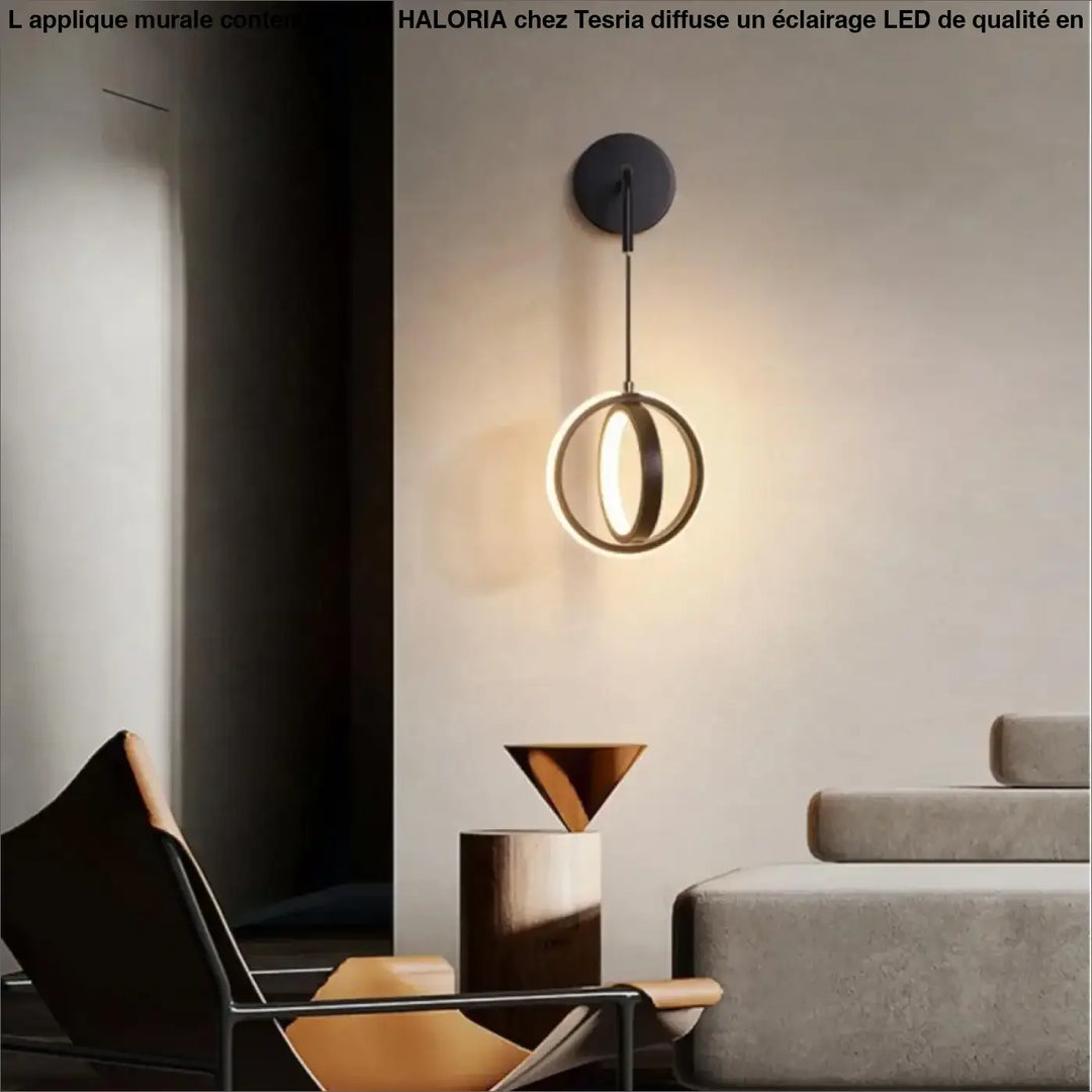 Applique murale contemporaine haloria avec base circulaire noire et deux anneaux concentriques dorés pour un éclairage moderne