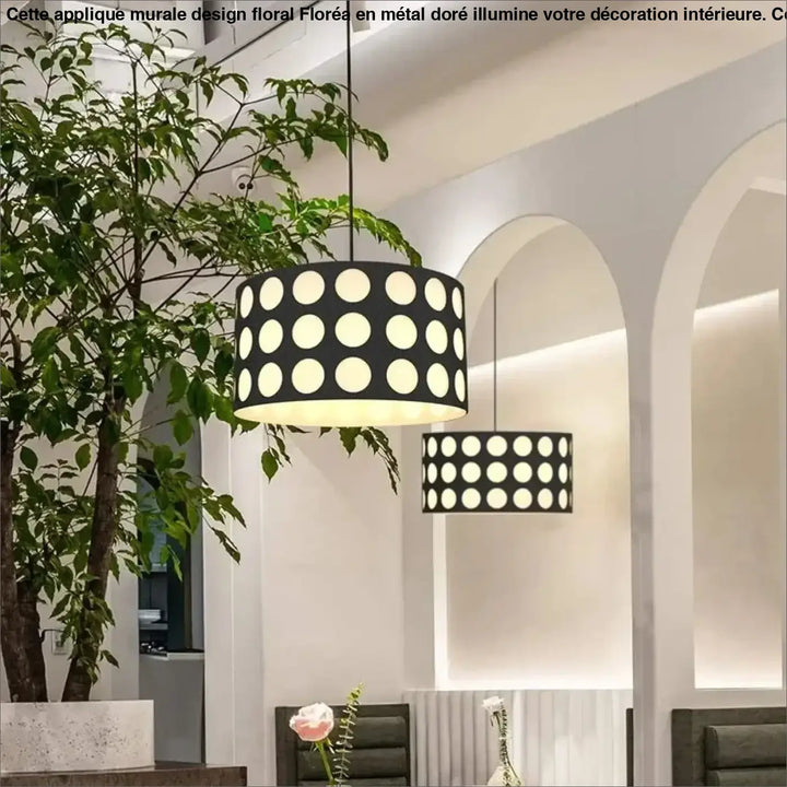 Suspension luminaire cylindrique noire nyxis avec motif de découpes circulaires blanches uniformes