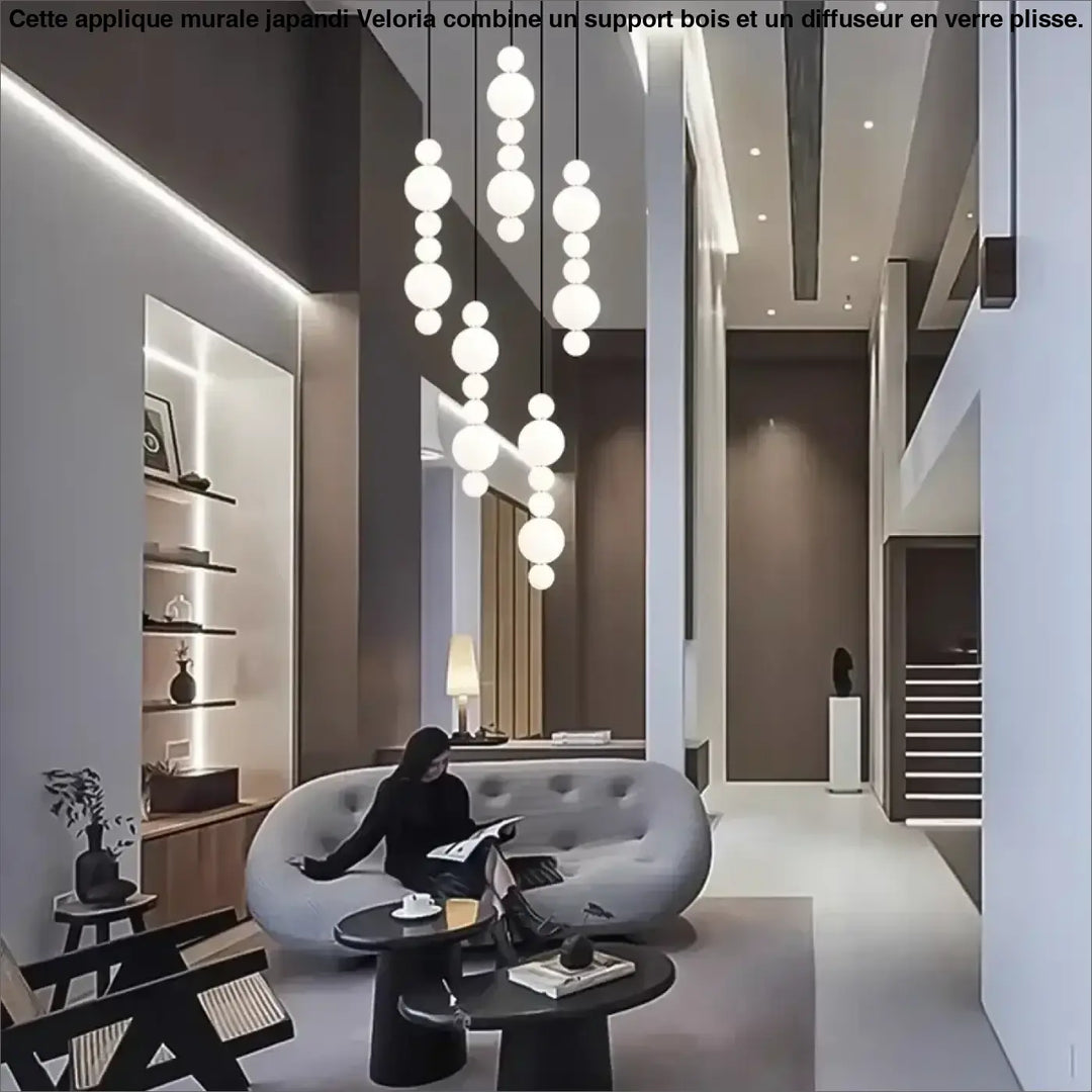 Suspension luminaire oxyo avec boules opalines en verre dépoli en chute verticale pour un éclairage moderne et élégant