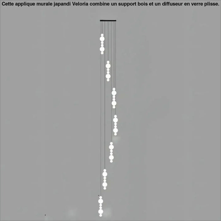Suspension luminaire oxyo avec boules opalines blanches et structure métallique noire minimaliste chute verticale