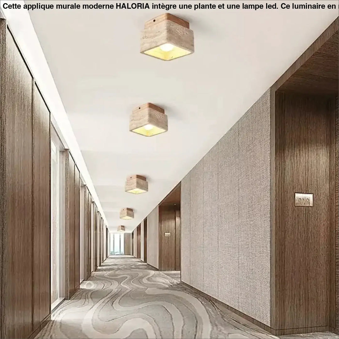 Plafonnier design carré en bois naturel avec finition pierre rustique émettant une lumière jaune chaleureuse pour décoration intérieure