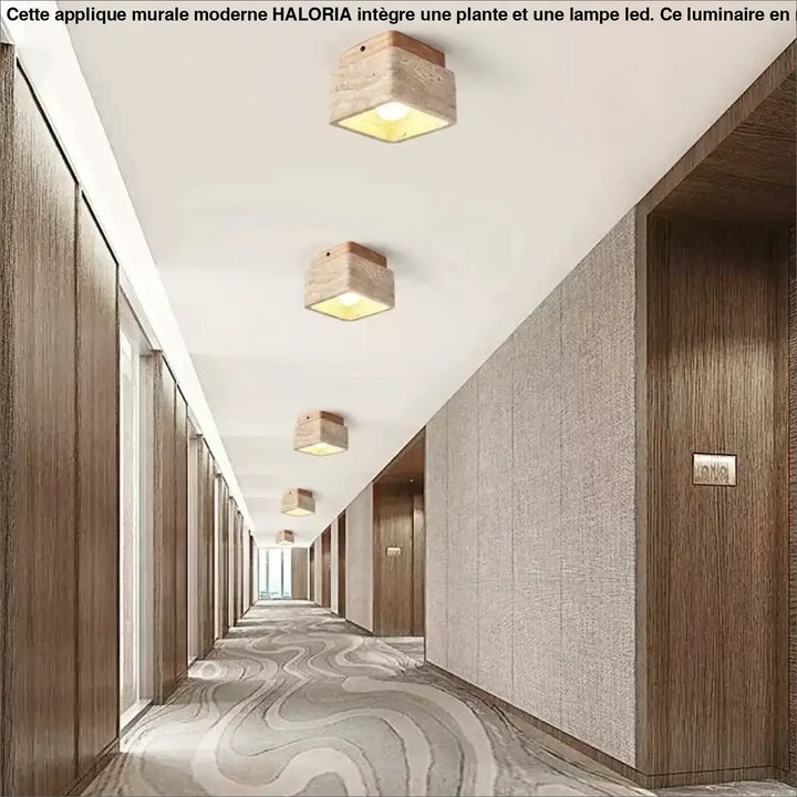 Plafonnier design carré en bois naturel avec finition pierre rustique émettant une lumière jaune chaleureuse pour décoration intérieure