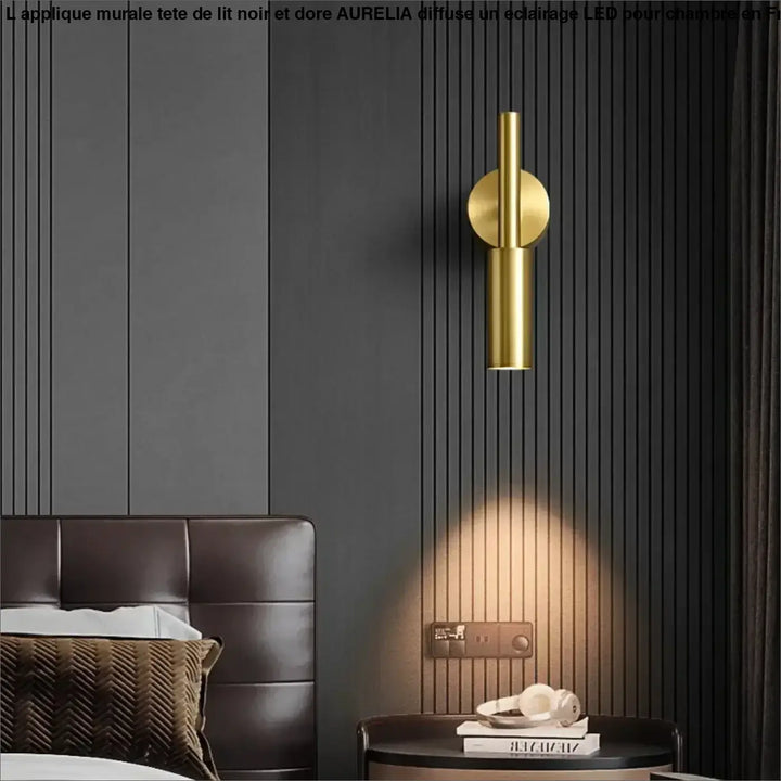 Applique murale tete dore en cylindrique avec base circulaire sur mur gris foncé panele, modele aurelia