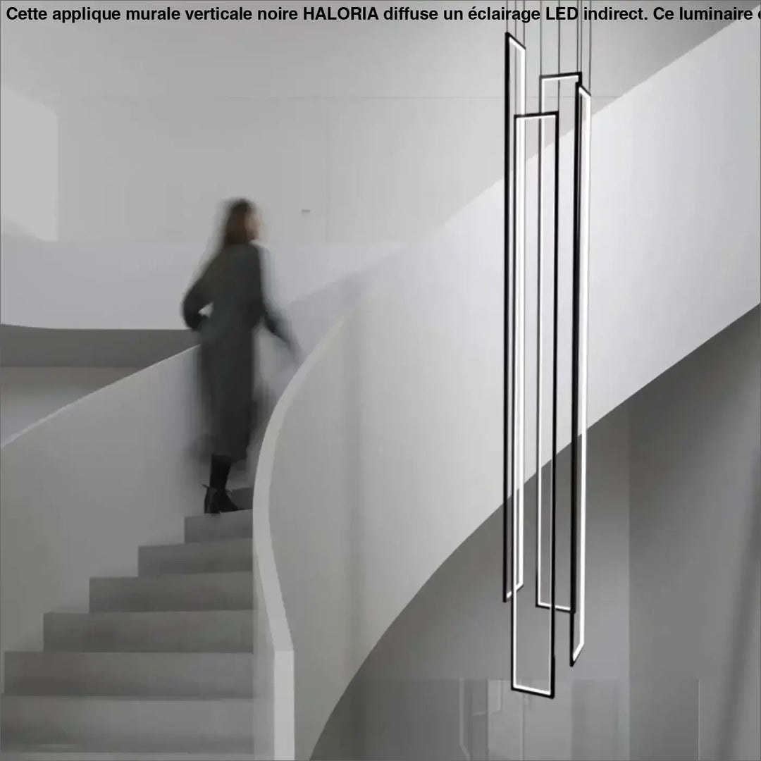 Suspension verticale noire avec cadres LED pour escalier