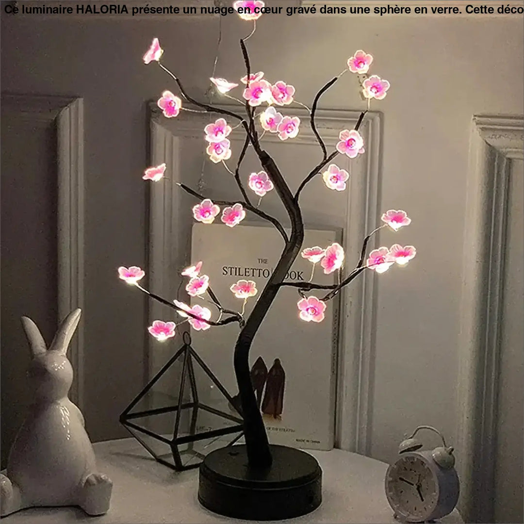 Veilleuse arbre lumineux flowy avec fleurs roses led et branches noires sur base circulaire pour décoration intérieure