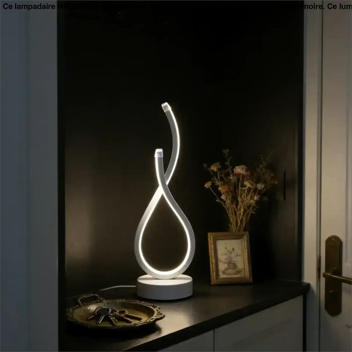 Lampe de table infinia avec boucle lumineuse blanche led et silhouette sculpturale moderne en design table