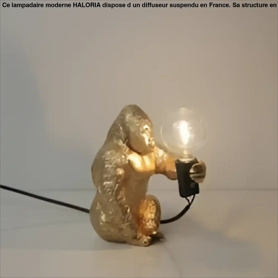 Lampe de table gorenzo artistique gorille dorée tenant une ampoule lumineuse table artistique gorille élégante