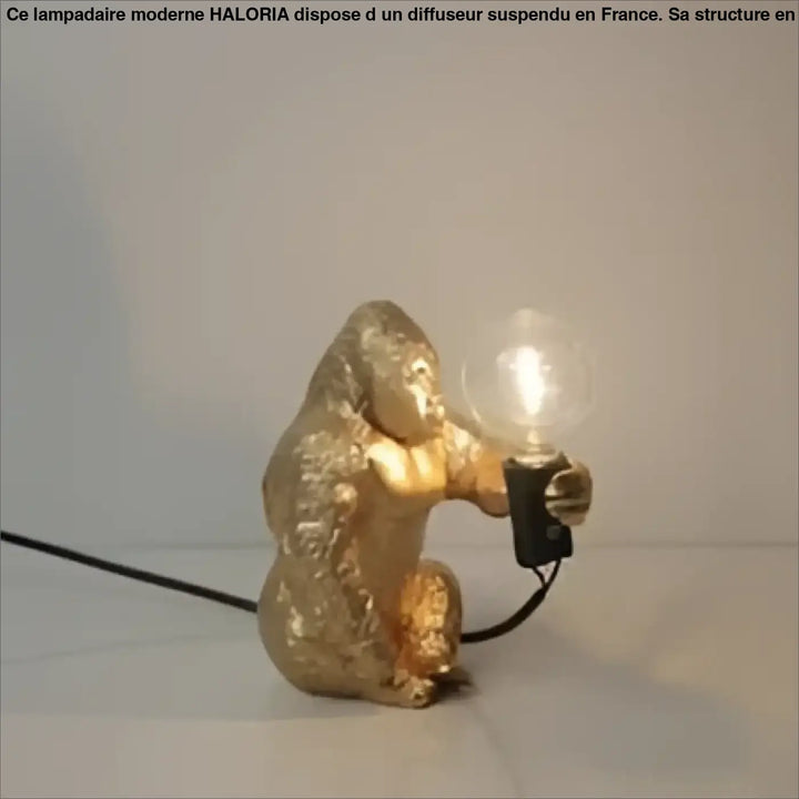 Lampe de table gorenzo artistique gorille dorée tenant une ampoule lumineuse table artistique gorille élégante