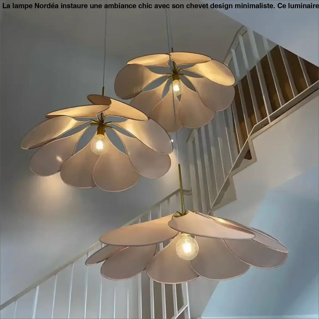 Three cream-colored floral suspension luminaires anthia with layered petals and brass-toned centers for elegant suspension luminaire design
