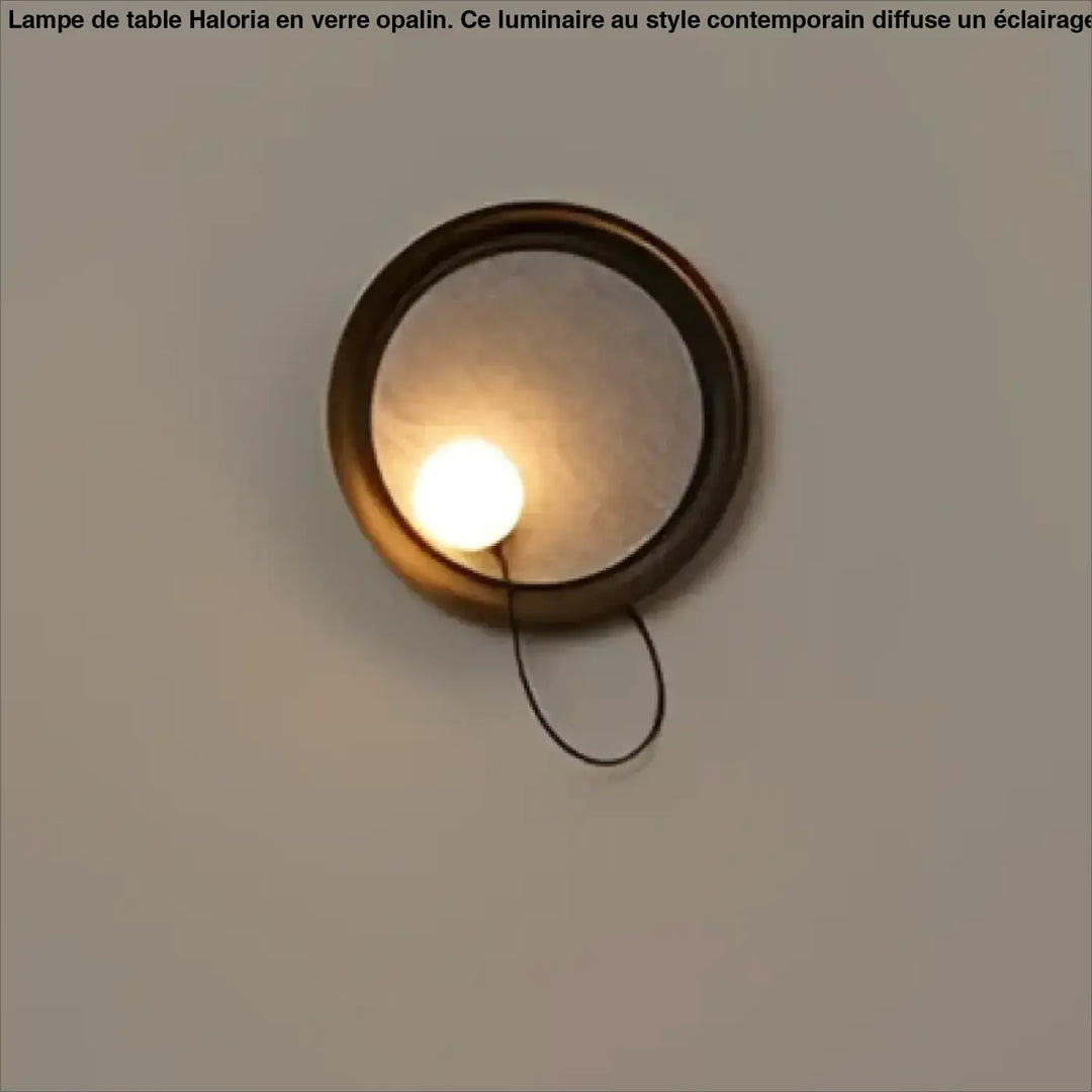 Applique murale contemporaine orluna en laiton rond avec miroir dépoli et cordon noir suspendu