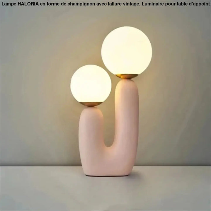 Lampe de table tsilo en céramique rose pastel avec deux globes en verre lumineux et accents dorés sont-elles incluses