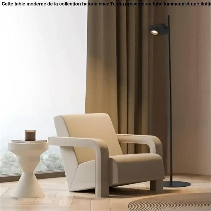 Cream-colored armchair with sleek modern design and smooth upholstery featured beside a lampadaire contemporain with spot ajustable luminaire capable lighting