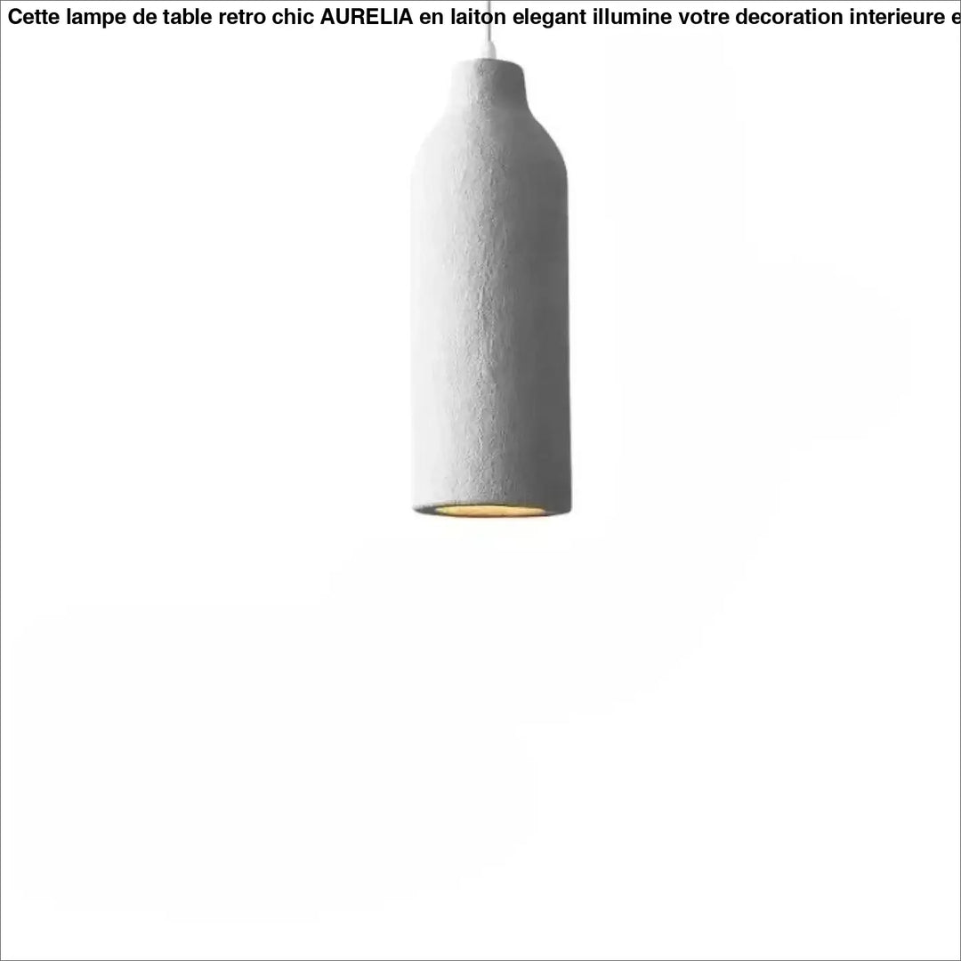 Une suspension minimaliste en béton gris avec un corps lisse et cylindrique et un revêtement intérieur aux tons chauds.
