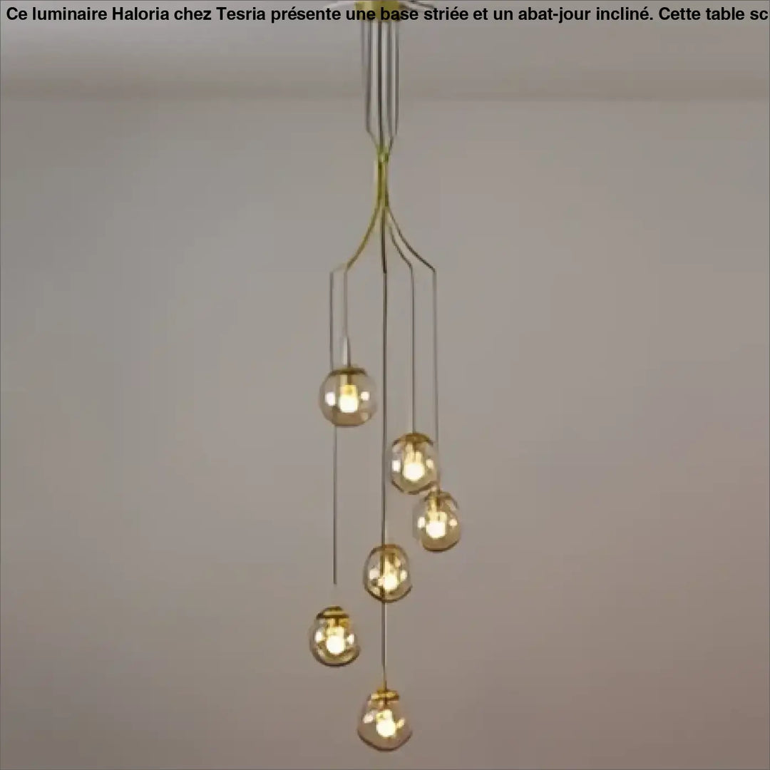 Suspension luminaire umami en métal doré avec plusieurs globes en verre sphériques suspendus à un support central