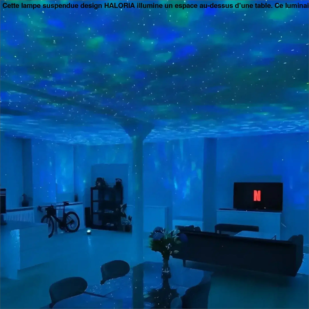 Lampe suspendue design haloria avec projection ciel étoilé bleu créant un motif cosmique galaxie dans la pièce
