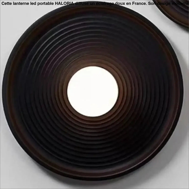 Applique murale vertigo circulaire brun foncé avec lumière douce centrale et design élégant à anneaux concentriques