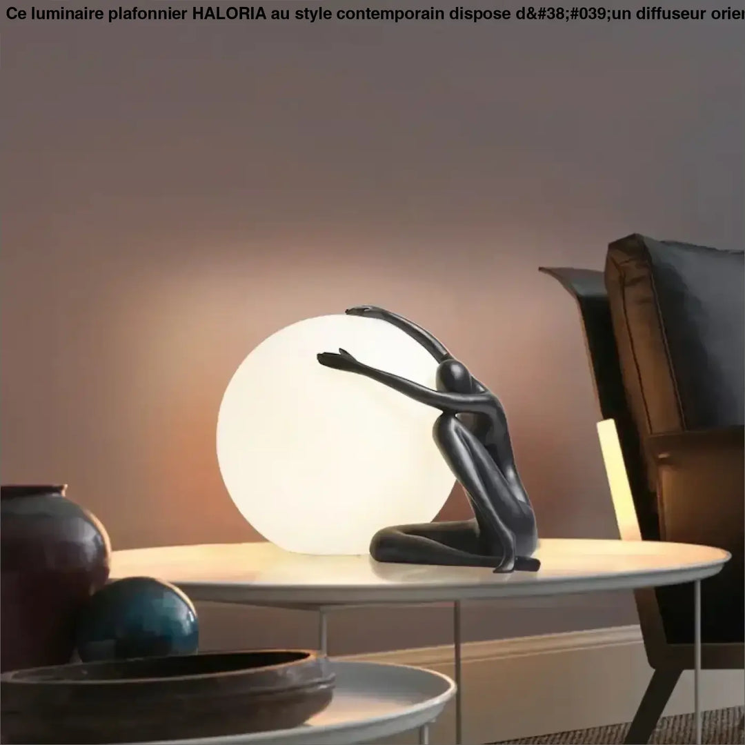 Lampe de table kelya noire en résine avec silhouette enlacée et lumière sphérique intégrée pour table design