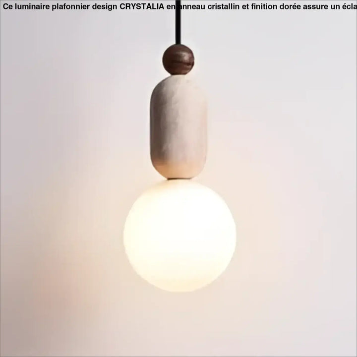 Suspension luminaire sora avec abat-jour cylindrique beige mat en pierre texturée et ampoule blanc chaud suspendue par cordon noir