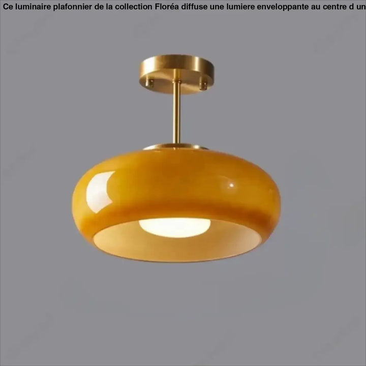 Suspension luminaire melora en verre teinté aux teintes ambres avec monture et tige en laiton finition brillante