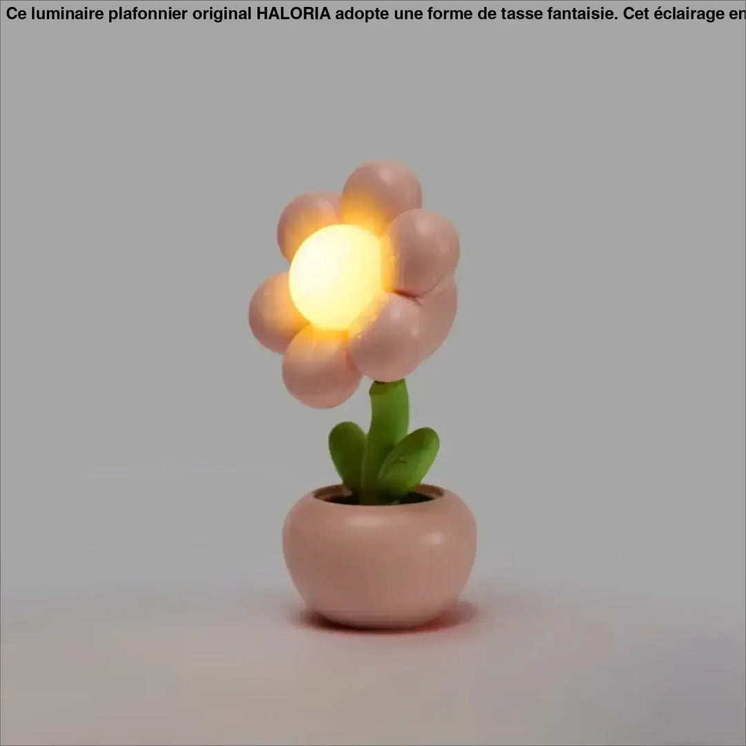 Veilleuse flower douce lumière douce en forme de fleur rose pastel avec centre jaune lumineux et pot décoratif vert