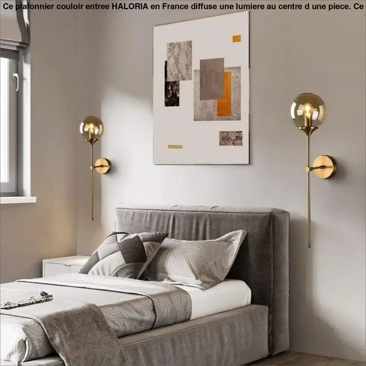 Plafonnier couloir entree gold-toned spherical wall sconces with slender stems and circular backplates by haloria
