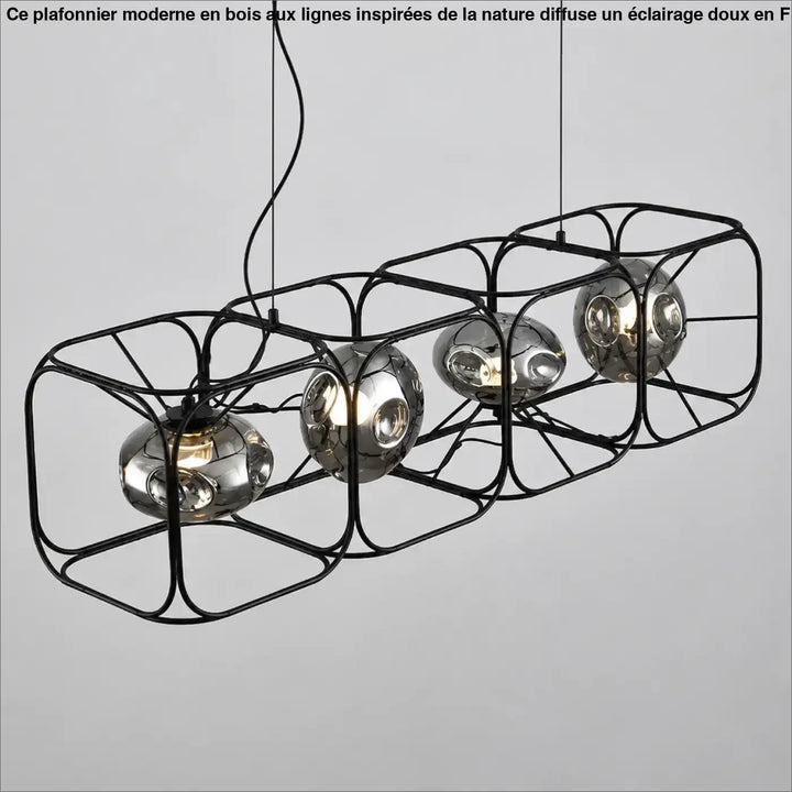 Suspension luminaire hexora en métal noir avec quatre globes en verre chromé reflétant un design moderne structure alvéolaire