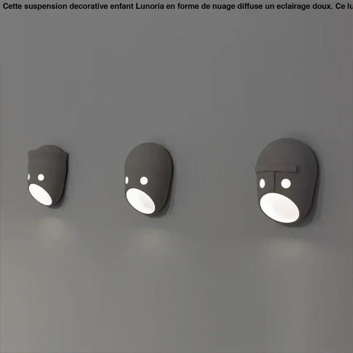 Trois suspensions décoratives enfant lunoria grises minimalistes avec visage arrondi et bouche lumineuse ovale