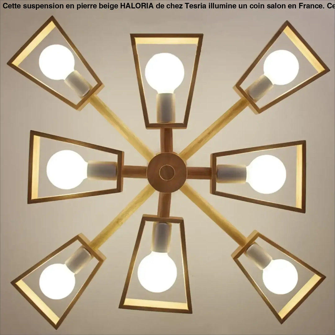 Suspension design en pierre beige forme dome moderne avec huit luminaires géométriques en laiton au-dessus d’une table