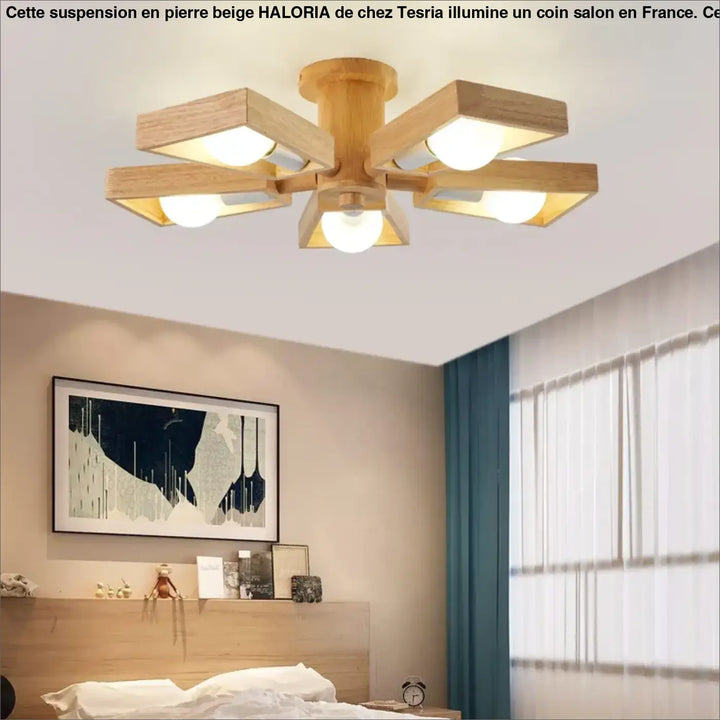Suspension design en pierre beige forme dome moderne avec bras carrés en bois au-dessus d’une table ou d’un coin salon