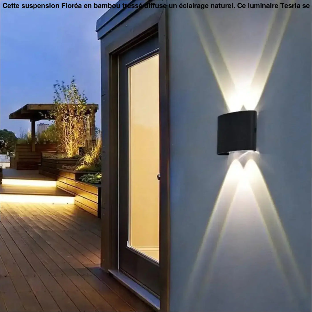 Luminaire led mural rectangulaire noir avec deux faisceaux inclinés blanc chaud au-dessus d’un coin salon floréa