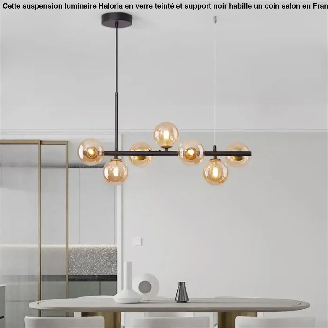 Suspension luminaire à boules de verre teinté sur un support noir

