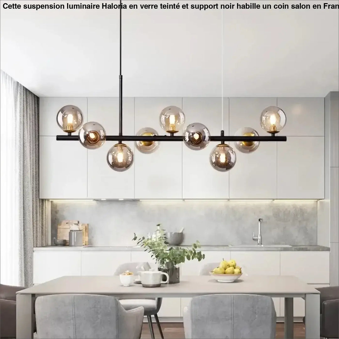 Suspension luminaire à boules de verre teinté sur un support noir

