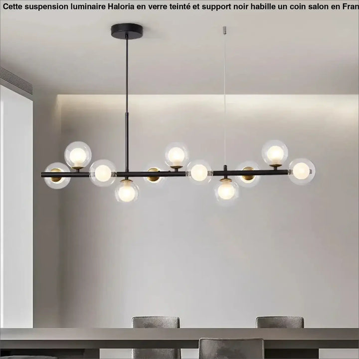 Suspension luminaire à boules de verre teinté sur un support noir

