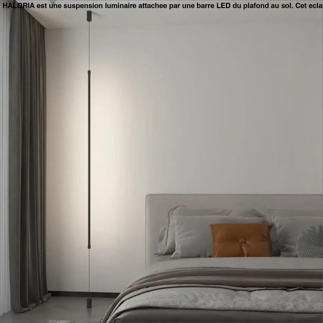 Suspension luminaire attachée au plafond au sol par une barre LED

