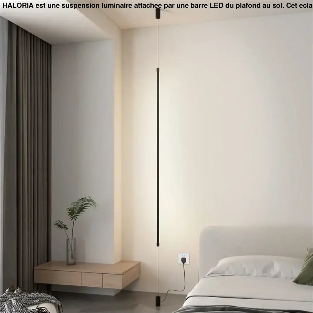 Suspension luminaire attachée au plafond au sol par une barre LED

