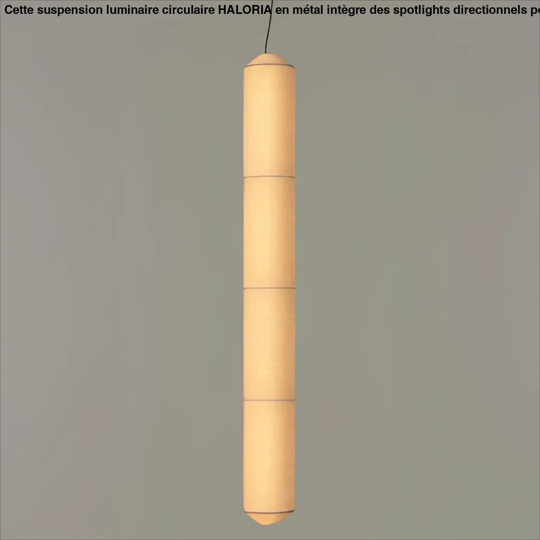 Suspension luminaire cylindrique en papier segmenté blanc offrant une lumière douce au-dessus d’une table