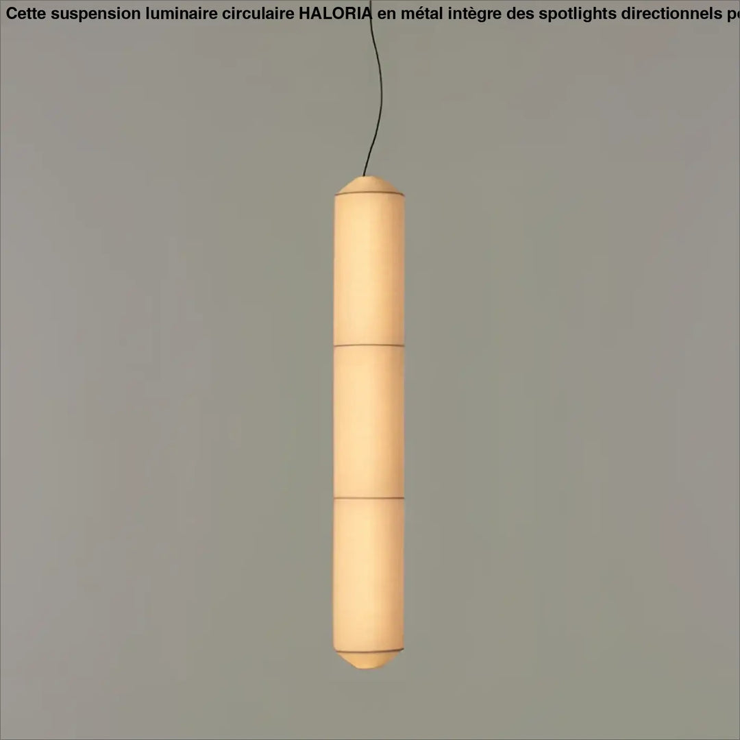 Suspension luminaire cylindrique en papier avec lumière douce chaleureuse au-dessus d’une table