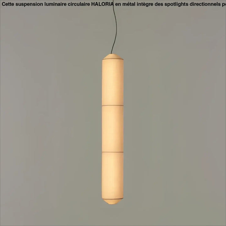 Suspension luminaire cylindrique en papier avec lumière douce chaleureuse au-dessus d’une table