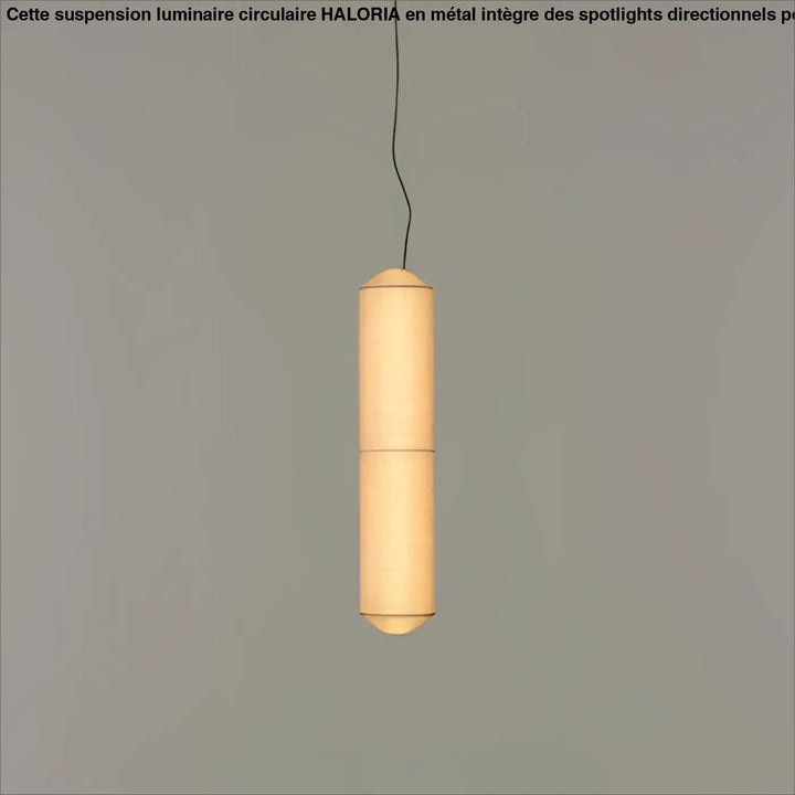 Suspension luminaire papieria en papier cylindrique chaleureux avec lumière douce et ridges verticales au-dessus d’une table