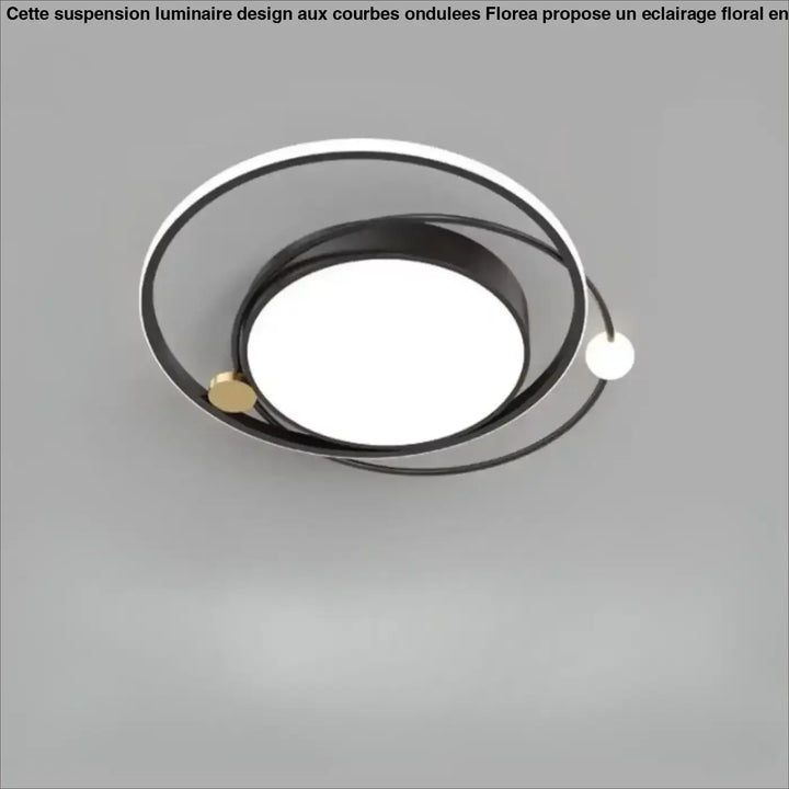 Luminaire plafonnier aloïs moderne avec design circulaire noir blanc et détails dorés pour lumière blanche ou chaude en salle à manger