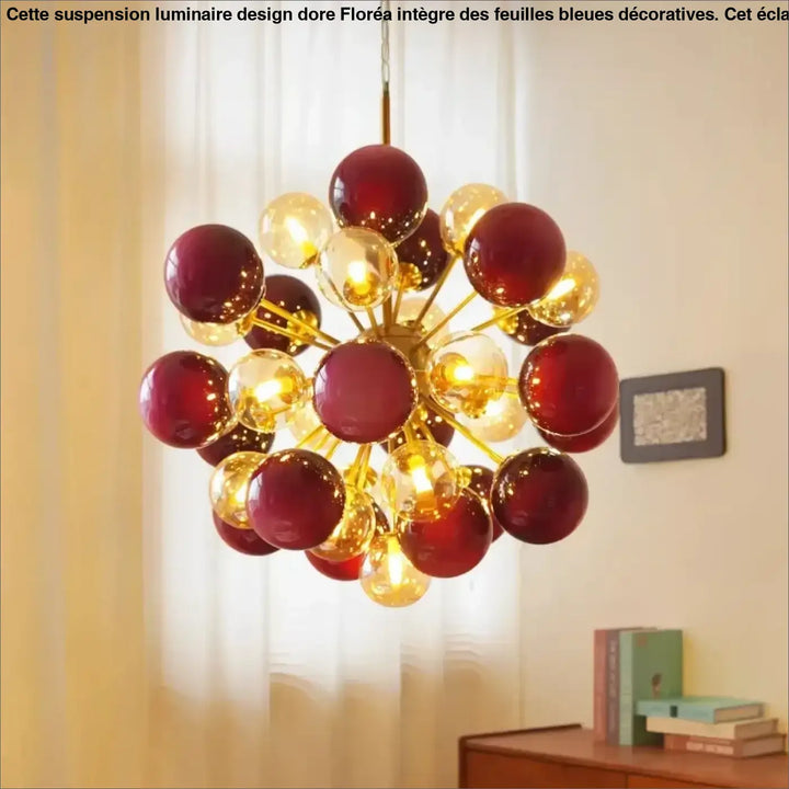 Suspension luminaire vintage samibia avec structure métallique dorée et orbes en verre rouge profond et ambre