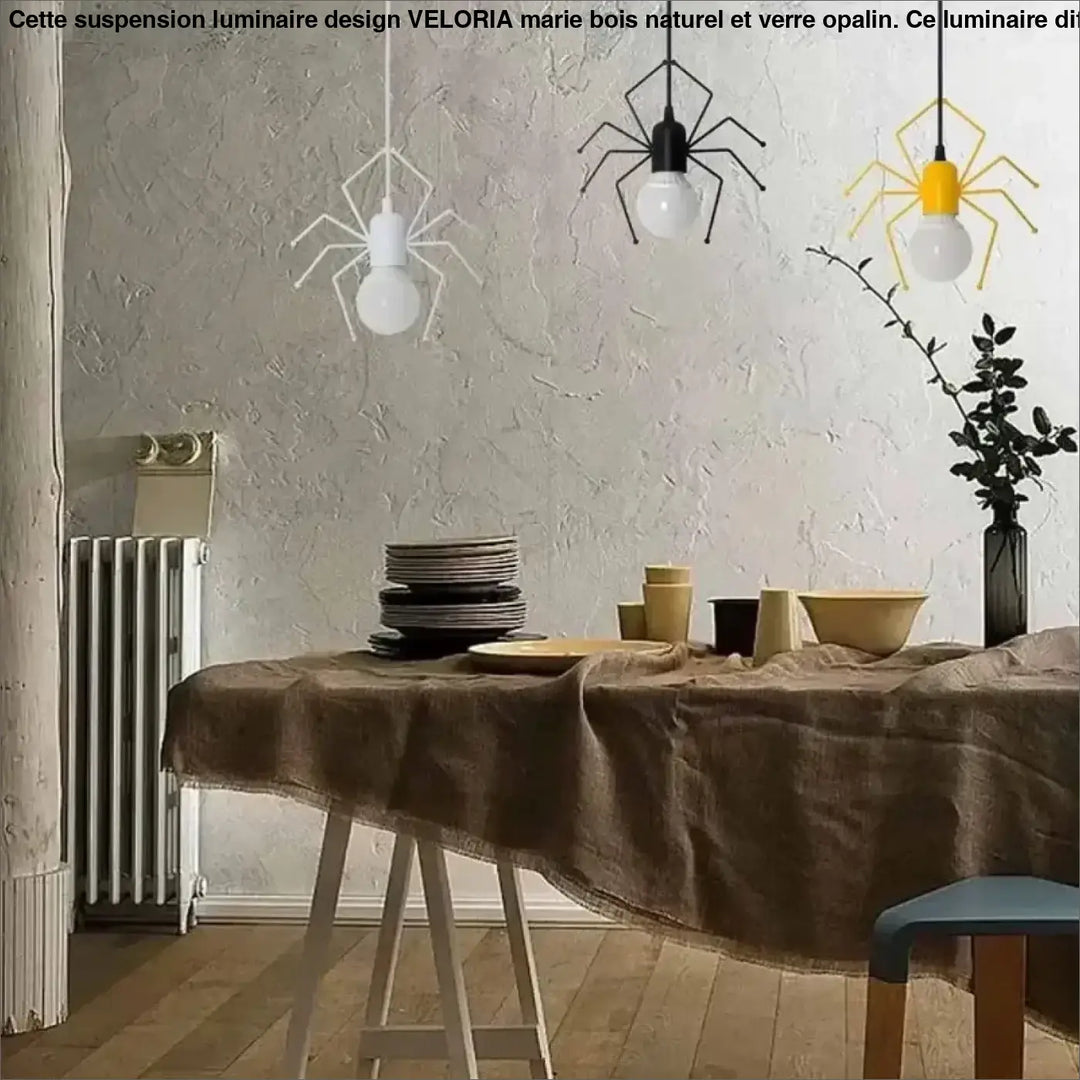 Suspension luminaire alako ludique avec trois cadres métalliques noirs blancs et jaunes en forme daraignée et ampoules apparentes